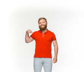 Closeup of young man's body in empty red t-shirt isolated on white background. Mock up for disign concept