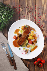 juicy steak with potato top view on rustick wood back