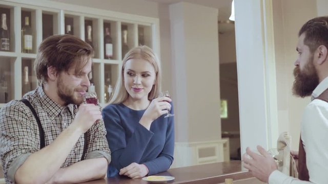 Couple in love. Handsome man flirting with cute woman in restaurant. Bearded man flirting with young sexy blonde