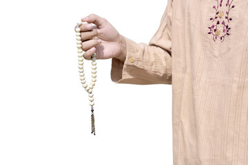 Muslim man holding prayer beads