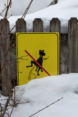Yellow Signboard: a Signal Prohibiting Dog Excrements near Fresh Snow