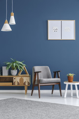 Grey armchair with wooden frame
