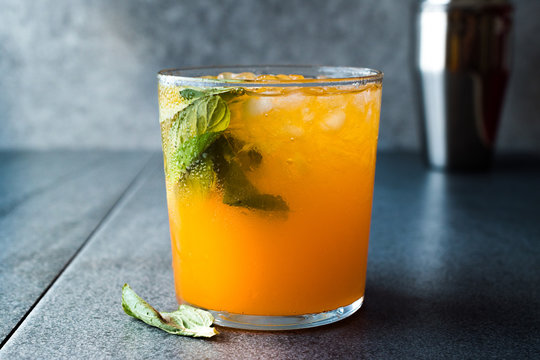 Mandarin Mojito Cocktail with Mint Leaves and Crushed Ice / Tangerine or Clementine