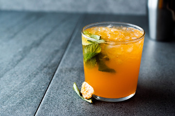 Mandarin Mojito Cocktail with Mint Leaves and Crushed Ice / Tangerine or Clementine