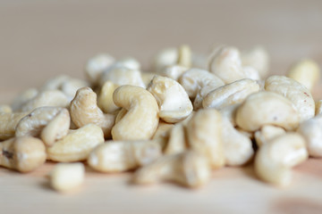 Cashew nuts on a wooden background close up