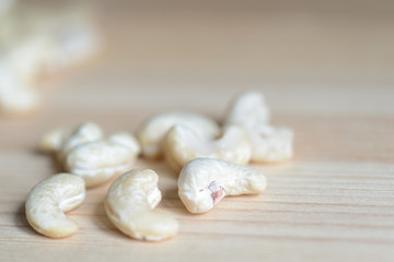 Cashew nuts on a wooden background close up