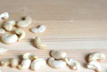 Cashew nuts on a wooden background close up