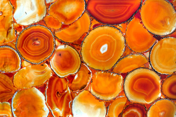 A beautiful red agate stone. A panel made of yellow agate.