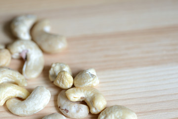 Cashew nuts on a wooden background close up