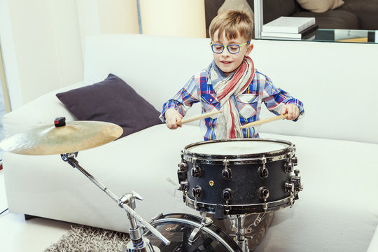 prodigy child plays the drums at home