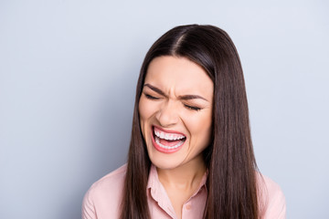 Obraz premium Portrait of psycho, nervous, crying, uncontrollable woman with violent irritated reaction, shouting with close eyes, grimace, tired from routine isolated on grey background