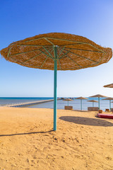Parasols on the beach of Red Sea in Hurghada, Egypt