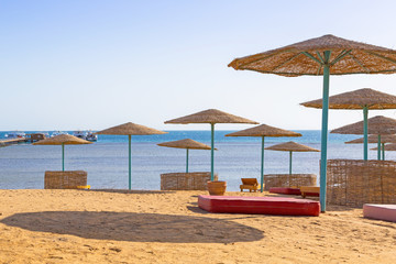 Parasols on the beach of Red Sea in Hurghada, Egypt