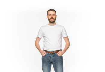 Closeup of young man's body in empty white t-shirt isolated on white background. Mock up for disign concept