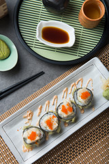 abalone salad roll sushi with tempura flat lay