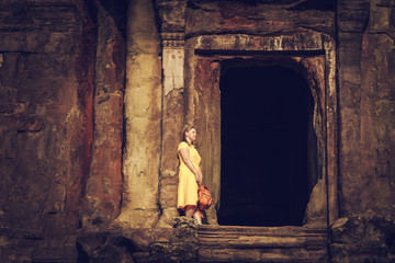 Tourist woman in the temple of Angkor Wat.