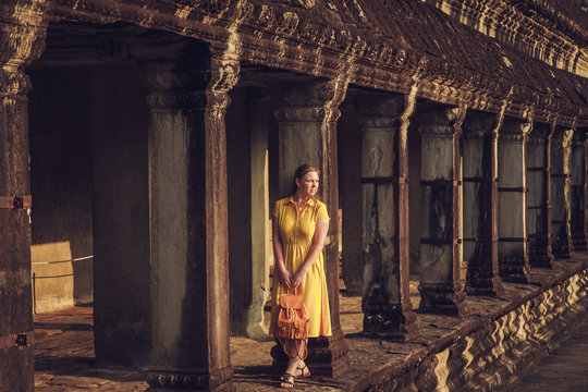 Tourist woman in the temple of Angkor Wat.