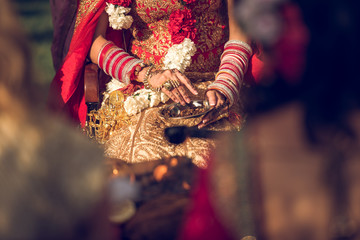Crop Hindu bride and groom
