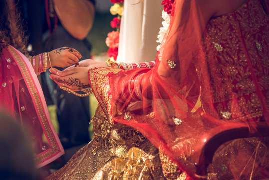 Crop Hindu bride and groom