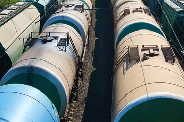 Many freight oil cars at the station. Close up.