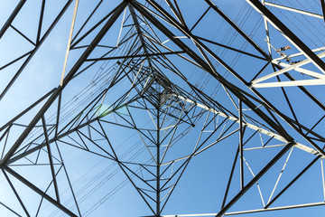 Obraz premium Underview of Structured Metal Engineering of Overhead Electricity Pylon