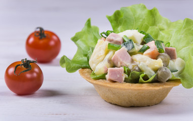 Traditional russian salad Olivier in tartlet