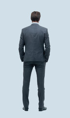 rear view . businessman looking at copy space