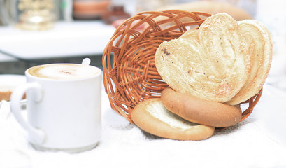 close up.Cup of tea and pastries for Breakfast on blurred background