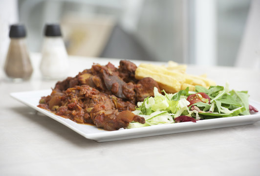 Traditional maltese food - rabbit with fresh vegetables. Malta. Fenek.