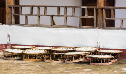 White rice in large baskets outdoors, Luang Prabang, Laos. Copy space for text.