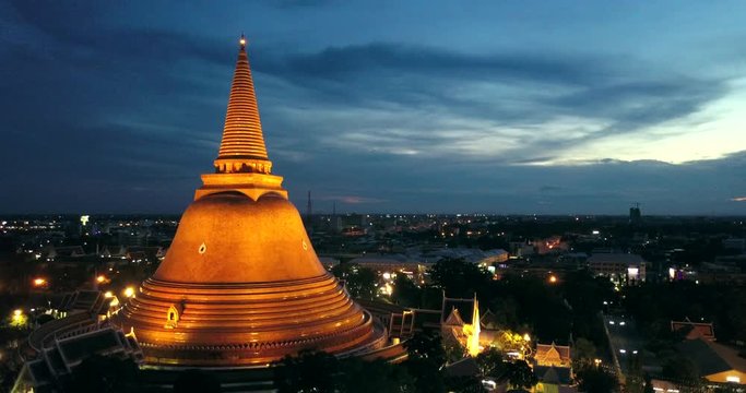4K. Aerial drone view of Phra Pathom Chedi at dusk, the great golden pagoda and world's tallest stupa in Nakhon Pathom, Southeast Asia, Thailand