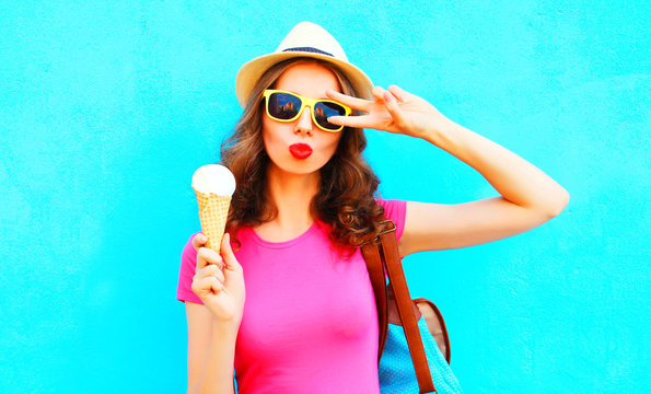 Cool girl with ice cream over colorful blue background