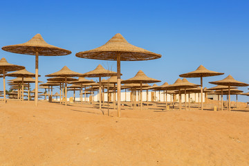 Parasols on the beach of Red Sea in Hurghada, Egypt