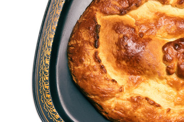 Pie with cabbage on a tray, isolated on a white background, on the right side of the frame