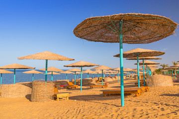 Parasols on the beach of Red Sea in Hurghada, Egypt