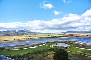Fototapeta na wymiar View of Botrivier Lagoon overlooking golf course arabella and mountains south-africa