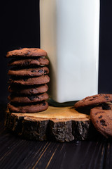 Home made chocolate drops cookies served with organic milk. Dark rustic style