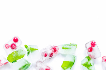 fresh cranberry in ice cubes on white background top view mock-u