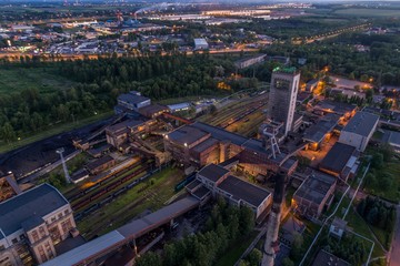 Fototapeta premium Aerial drone view black coal mine at dusk.