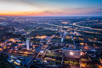 Fototapeta premium Aerial drone view black coal mine at dusk.