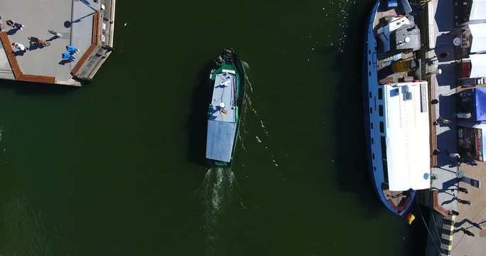 Aerial View. Motor boat enters into the river. Klaipeda County, Curonian Lagoon