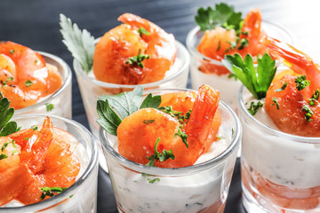 Glasses with fried shrimps and sauce, closeup