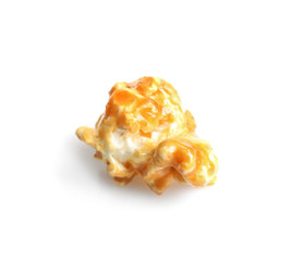Delicious popcorn with caramel on white background