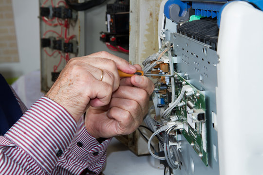 electrician fixing eletrical devices