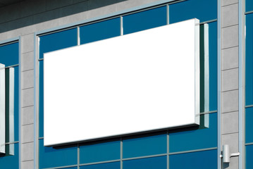 Blank horizontal billboard against a blue sky.