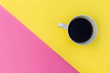 Coffee cup on minimal yellow background