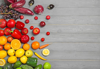 Naklejka na ściany i meble Rainbow composition with fresh vegetables and fruits on wooden background, flat lay