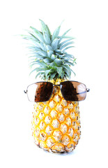 Pineapple fruits with sunglass on white backgrounds