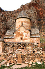 Fototapeta na wymiar Scenic Novarank monastery in Armenia. Noravank monastery was founded in 1205. It is located 122 km from Yerevan in a narrow gorge made by the Darichay river nearby the city of Yeghegnadzor