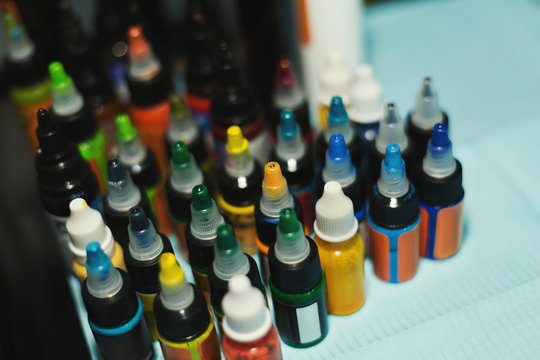 Multiple bottles with colorful inks for tattoo